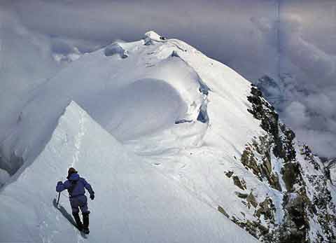 
Shishapangma Southwest Face First Ascent May 28 1982: Alex MacIntyre returns along the Central Summit ridge. Roger Baxter-Jones is seen as a tiny dot on the shoulder below the final humps of the Shishapangma Main Summit. - Shisha Pangma: The Alpine-Style First Ascent Of The South-West Face book
